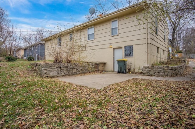 back of house with a patio