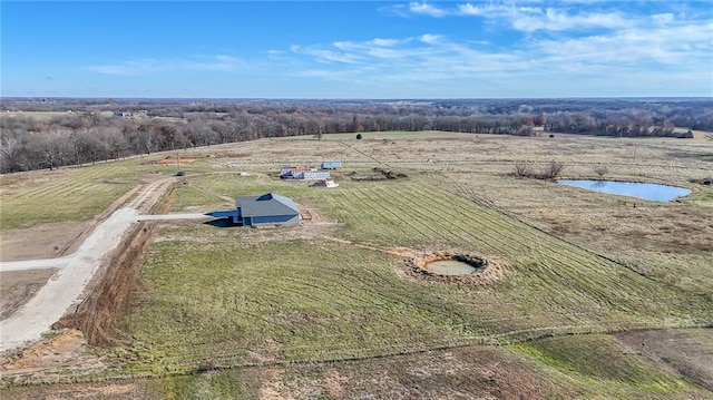 bird's eye view with a water view and a rural view