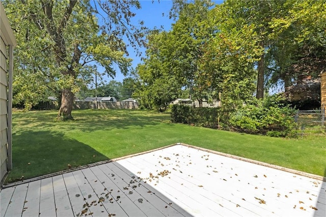 wooden deck with a lawn