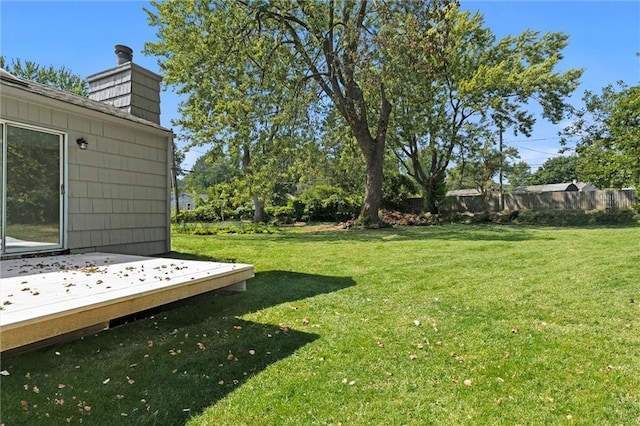 view of yard with a wooden deck