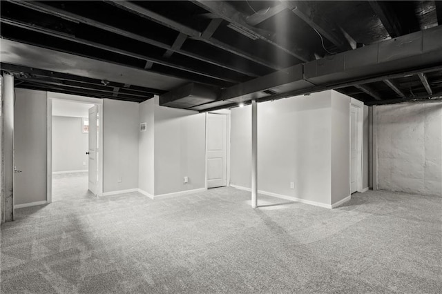 basement featuring carpet flooring