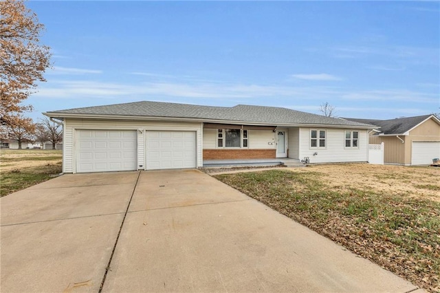 ranch-style home with a front yard and a garage