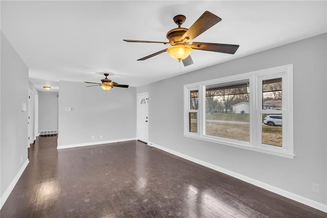 unfurnished living room featuring dark wood-type flooring