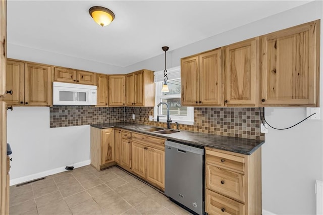 kitchen featuring decorative light fixtures, stainless steel dishwasher, tasteful backsplash, and sink