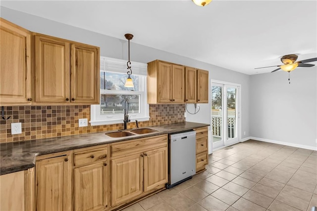 kitchen featuring ceiling fan, sink, light tile patterned floors, dishwasher, and hanging light fixtures