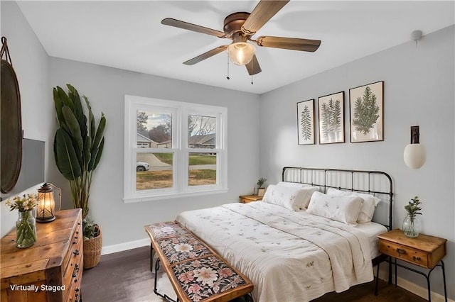 bedroom featuring dark hardwood / wood-style floors and ceiling fan