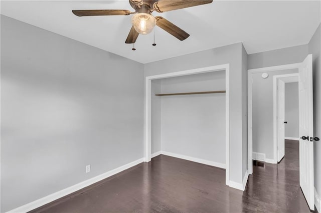 unfurnished bedroom featuring a closet, ceiling fan, and dark hardwood / wood-style floors