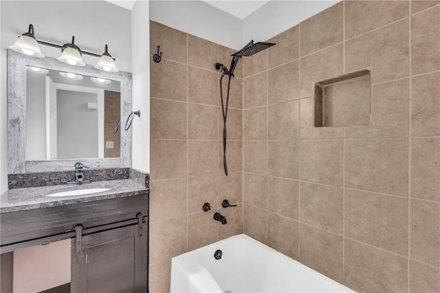 bathroom with vanity and tiled shower / bath combo