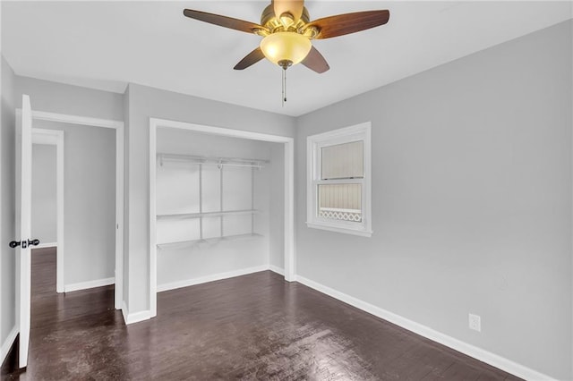 unfurnished bedroom featuring ceiling fan and a closet