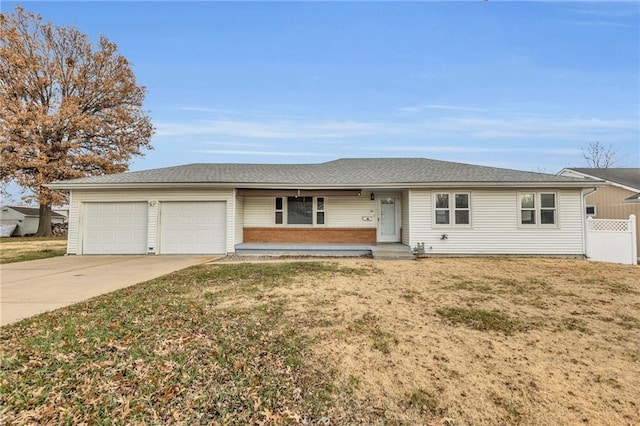 ranch-style house featuring a front lawn and a garage