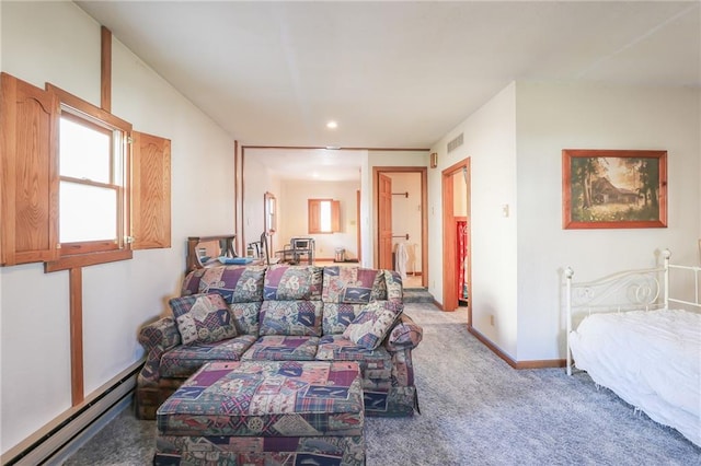 carpeted living room with a baseboard heating unit