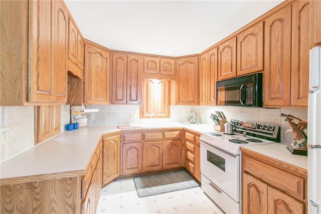 kitchen featuring decorative backsplash, white appliances, and sink