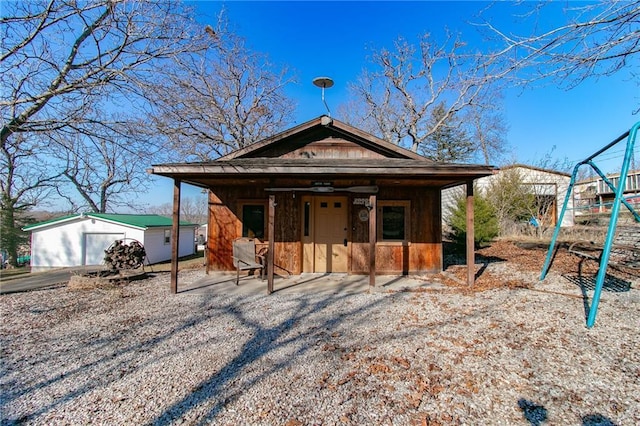 view of front of home featuring an outbuilding