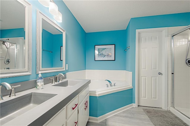 bathroom with hardwood / wood-style flooring, vanity, and plus walk in shower