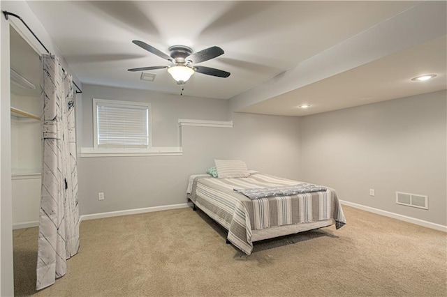 bedroom featuring visible vents, carpet floors, baseboards, and ceiling fan