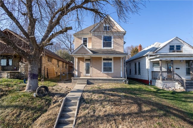 view of front of property featuring a front yard and a porch