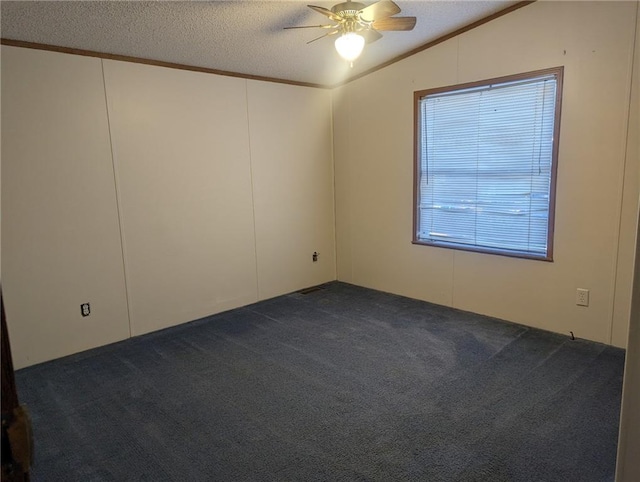 carpeted empty room with ceiling fan, a textured ceiling, crown molding, and lofted ceiling