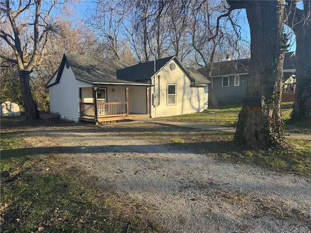 ranch-style home with covered porch