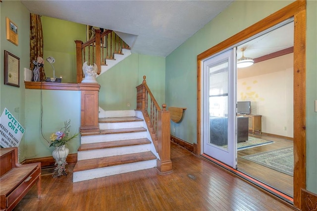 stairs with wood-type flooring