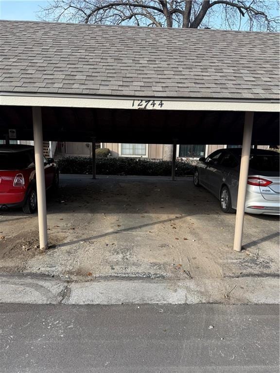 view of vehicle parking with a carport