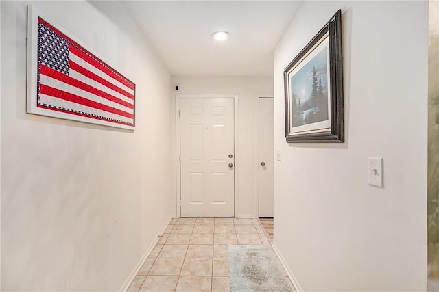 hallway with light tile patterned floors