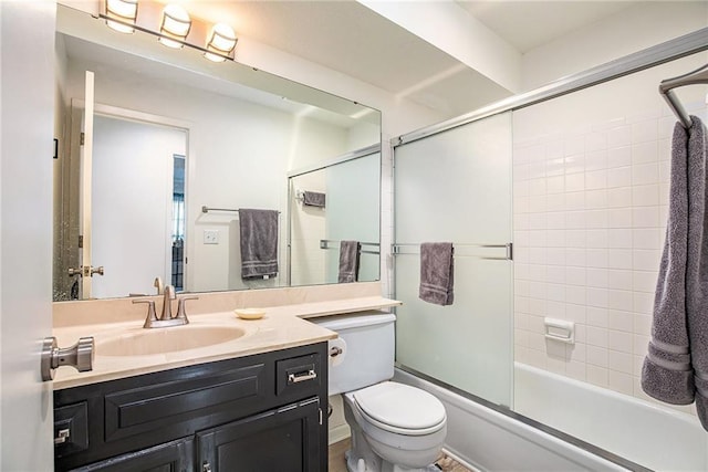 full bathroom featuring vanity, toilet, and enclosed tub / shower combo