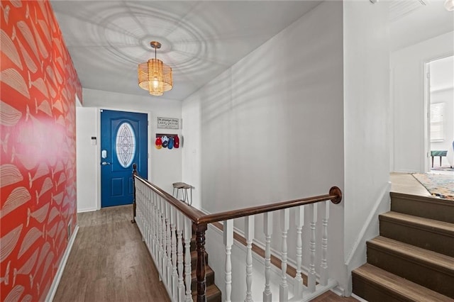 foyer entrance featuring wood finished floors and baseboards