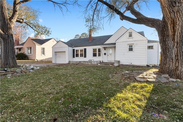 view of front facade with a garage and a front lawn