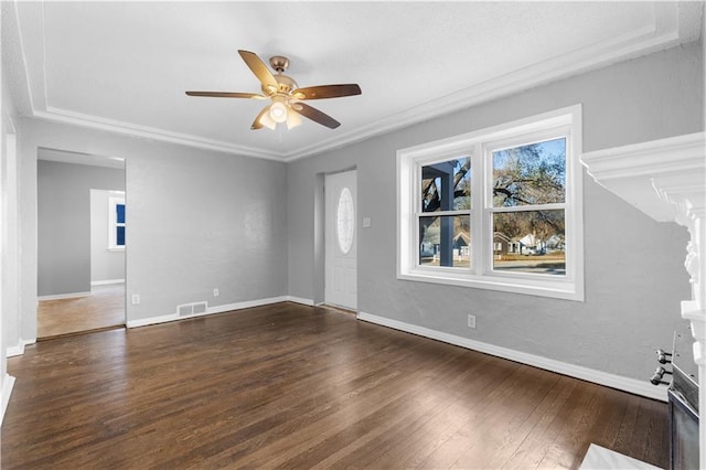 interior space with ceiling fan, dark hardwood / wood-style flooring, and crown molding