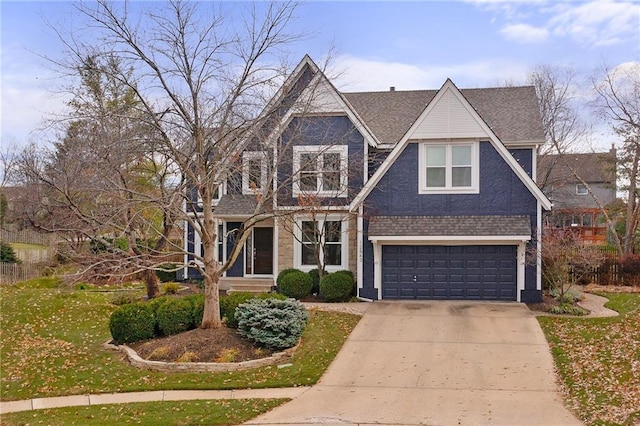 view of front facade featuring a front yard and a garage