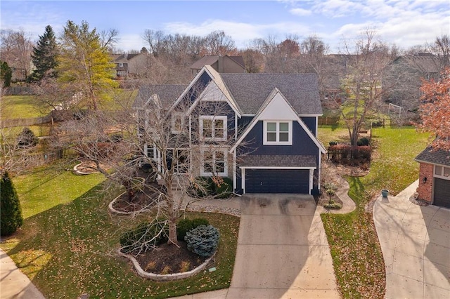 view of front of home featuring a garage and a front yard