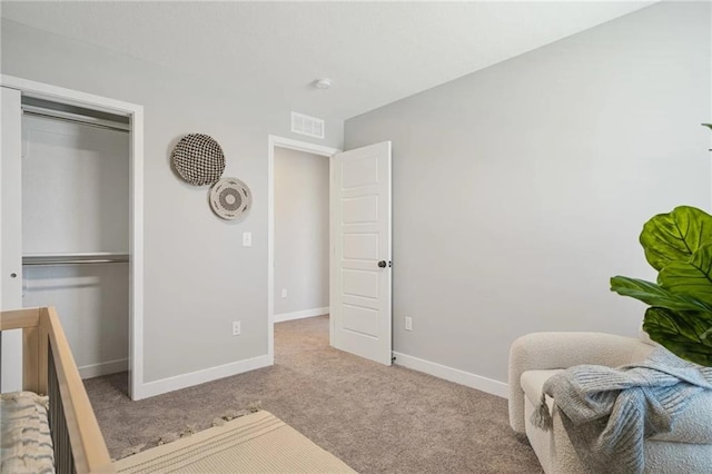 carpeted bedroom featuring a closet