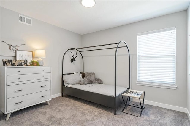 bedroom with light carpet