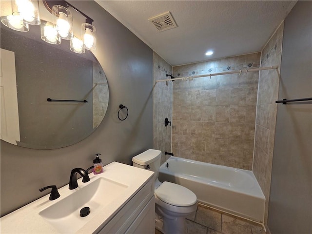 909 N Fulton St, Butler, MO 64730 - bathroom with tub / shower combination, vanity, and recessed lighting