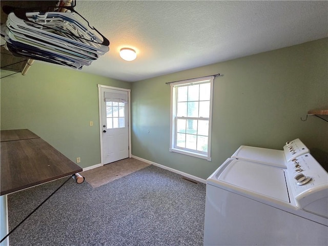 909 N Fulton St, Butler, MO 64730 - laundry area with separate washer and dryer, carpet, and a textured ceiling