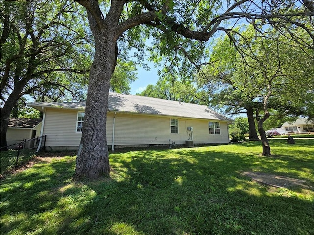 909 N Fulton St, Butler, MO 64730 - rear view of house with crawl space