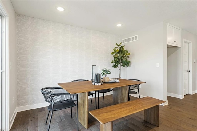 dining space with hardwood / wood-style floors