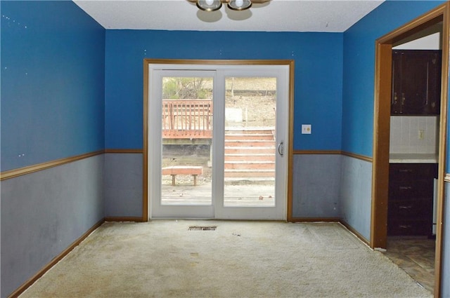 entryway featuring carpet floors