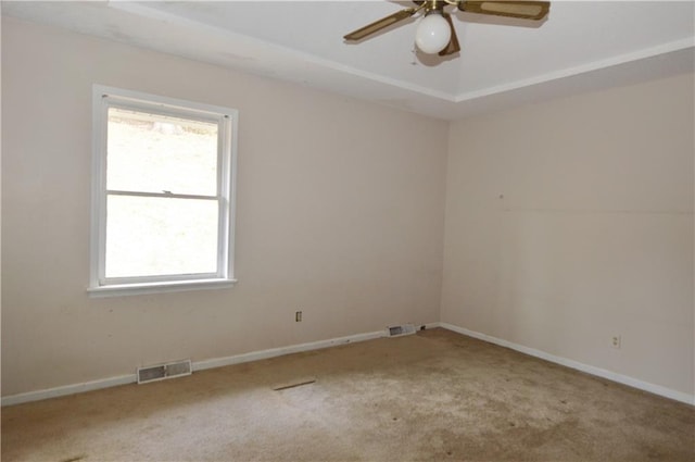 empty room featuring light carpet and ceiling fan