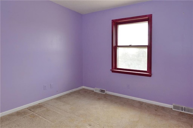 empty room with light colored carpet