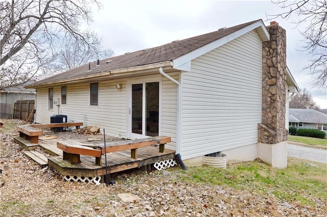 rear view of house with a wooden deck