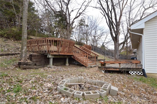 view of yard with a fire pit and a deck