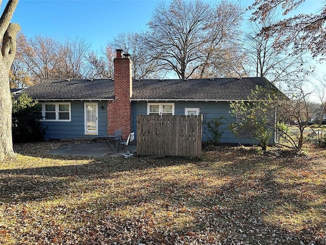 back of property with a patio