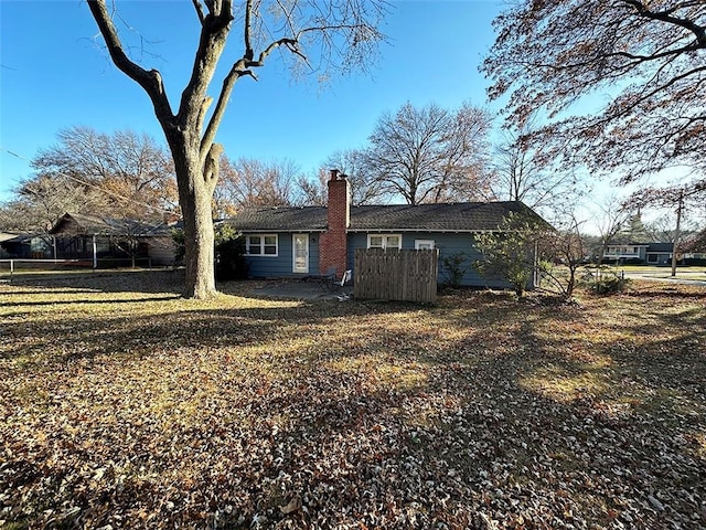 back of house with a yard