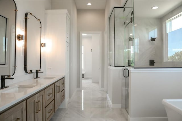 21513 W 80th Ter, Shawnee, KS 66220 - full bath featuring a shower stall, double vanity, a freestanding bath, marble finish flooring, and recessed lighting