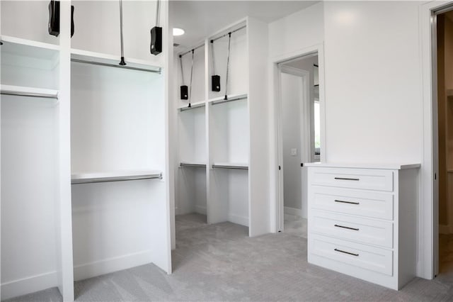 21513 W 80th Ter, Shawnee, KS 66220 - walk in closet featuring light colored carpet