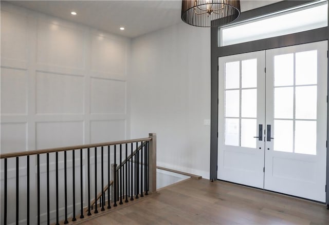 21513 W 80th Ter, Shawnee, KS 66220 - doorway with wood finished floors, french doors, recessed lighting, and plenty of natural light