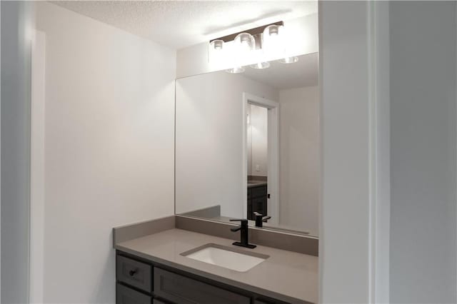 21513 W 80th Ter, Shawnee, KS 66220 - bathroom featuring vanity and a textured ceiling