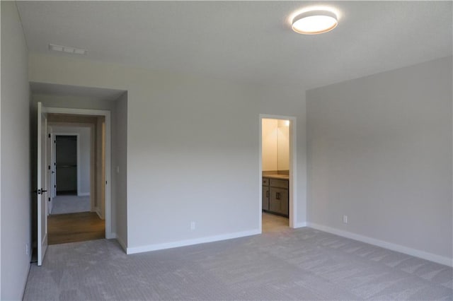 21513 W 80th Ter, Shawnee, KS 66220 - unfurnished bedroom with light carpet and ensuite bathroom