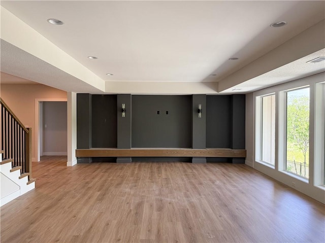 21513 W 80th Ter, Shawnee, KS 66220 - unfurnished living room featuring light wood-type flooring and stairway